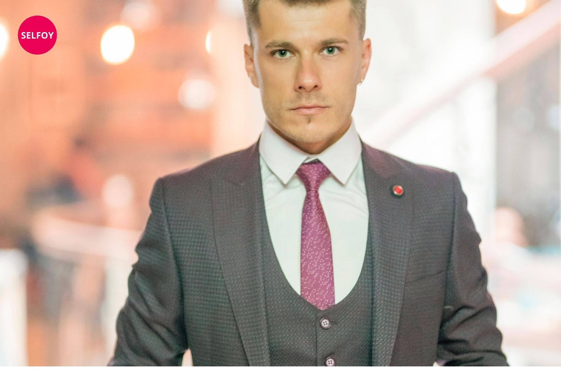 man in suit looks stoic and thinking about does autodidact work with self care