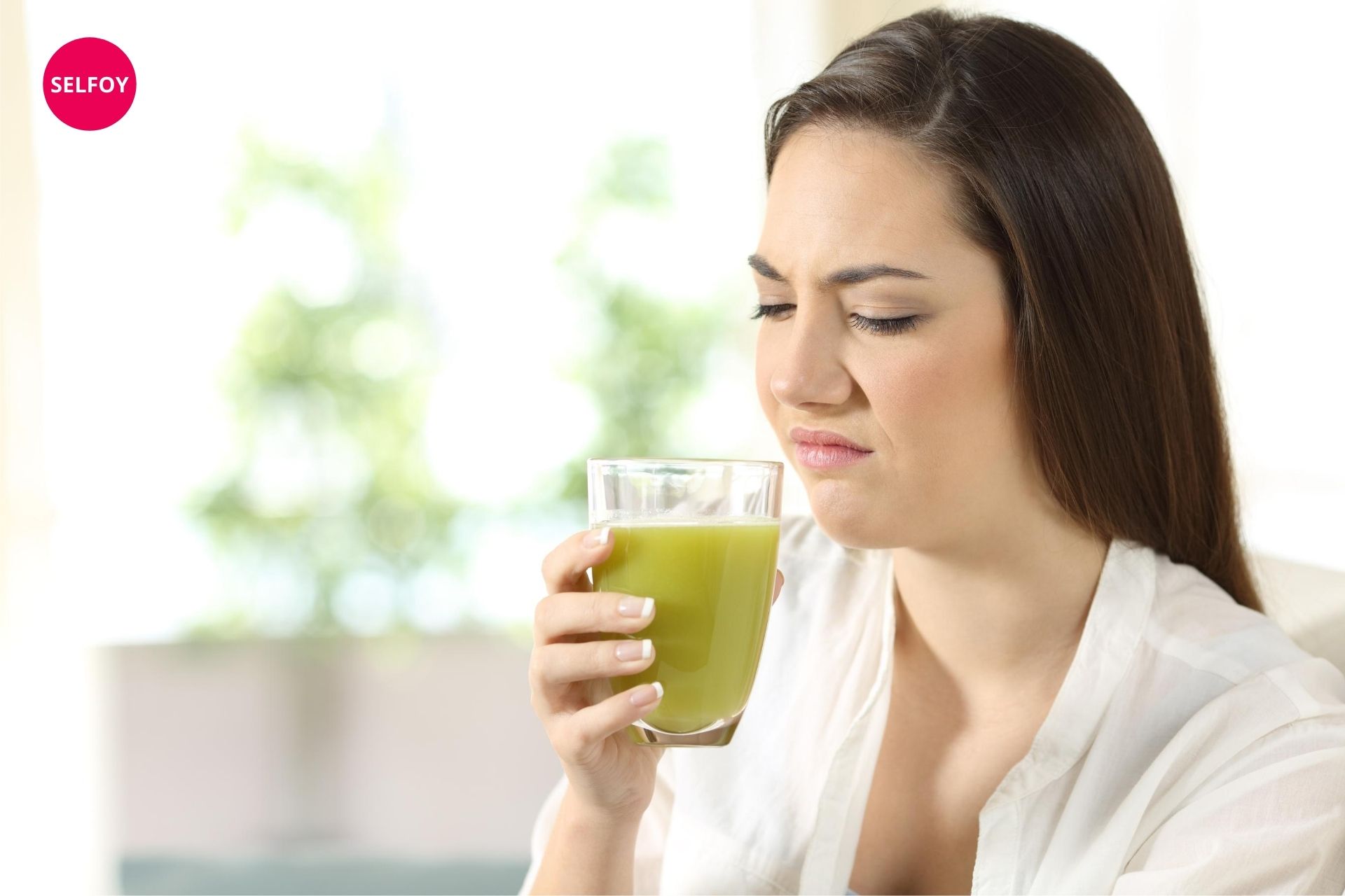 Woman is reluctant to drink detox drink