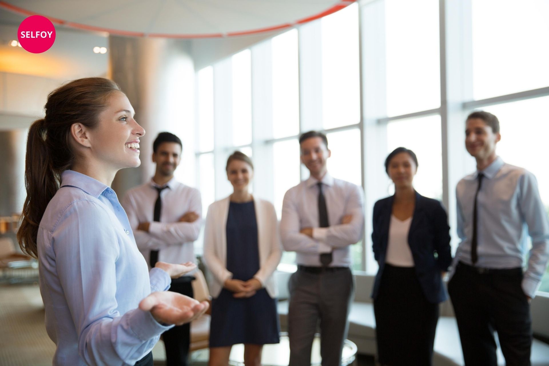 woman smiling and saying does autodidact work with self care to her team