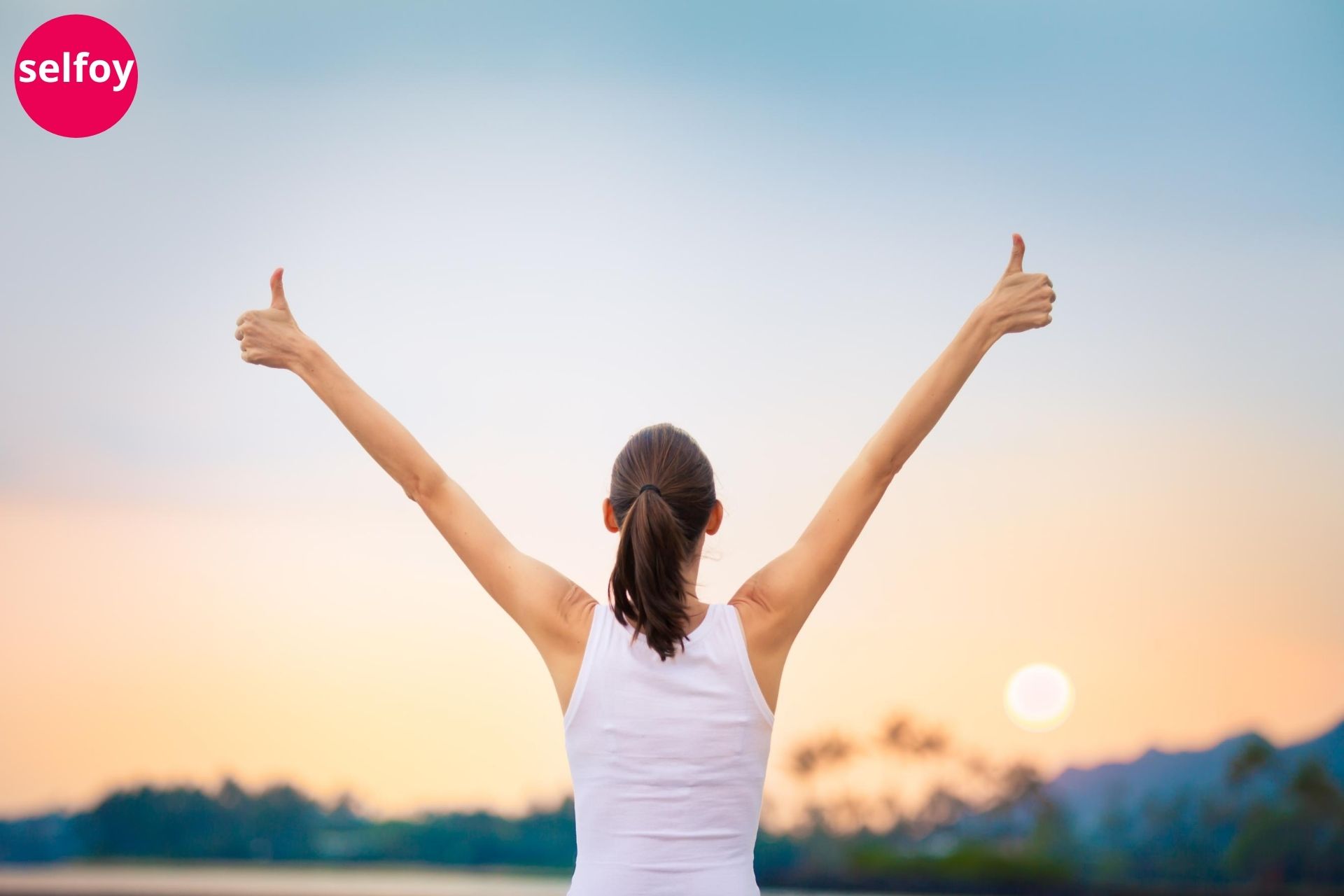  Woman doing hands up and showing ok signs