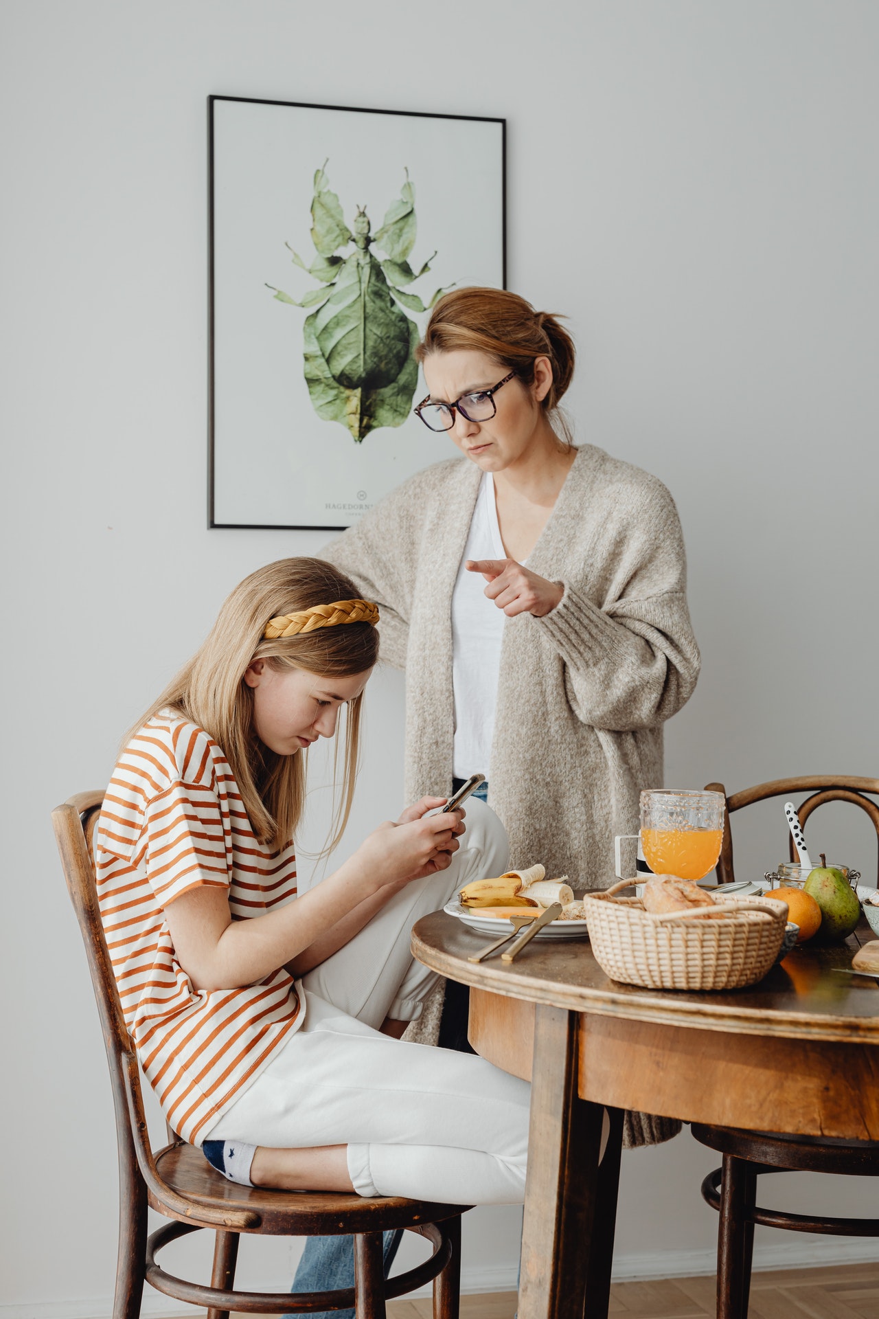 Girl sitting on chair checking text on her phone