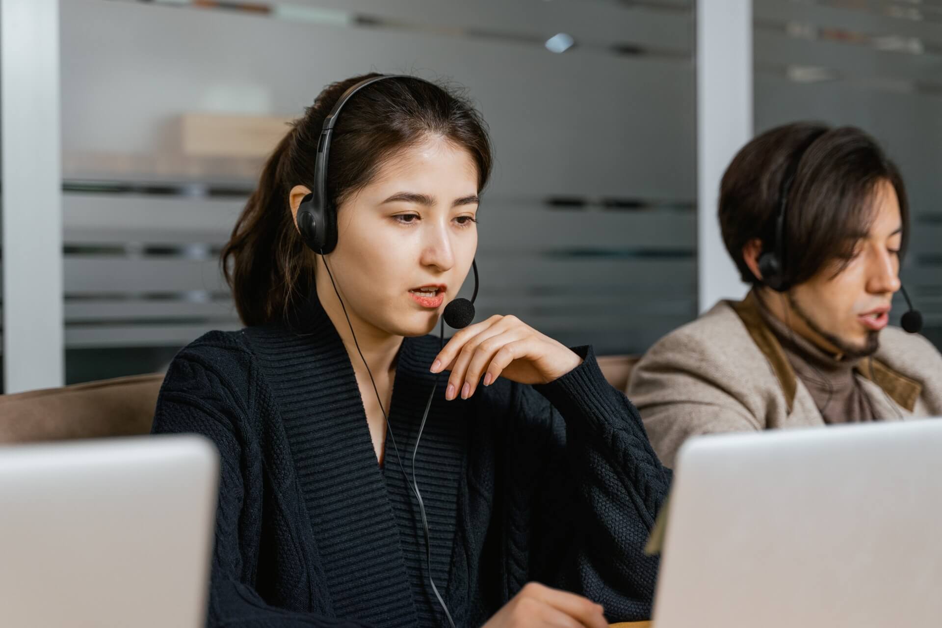 Girl-wearing-black-suit-making-spam-phone-calls