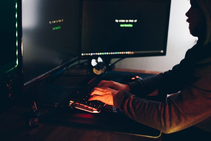 man is watching at computer