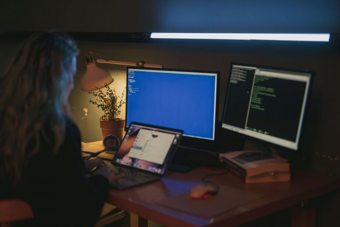 Girl coding at her pc