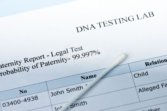 paternity test results with lab sample swab.